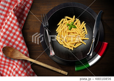 Dish of Italian Pasta - Raw food called Penne Dish of Italian Pasta - Raw food called Penne 48010856