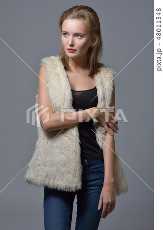 beautiful blonde woman in fur jacket. 48011348