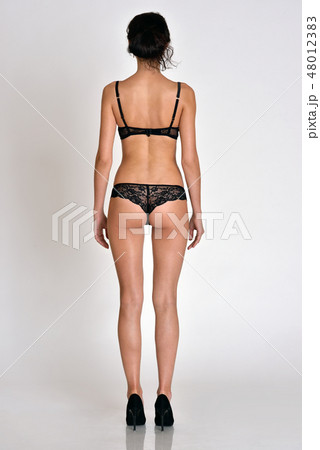 Back woman full lenght figure in underwear Back woman full lenght figure in underwear 48012383