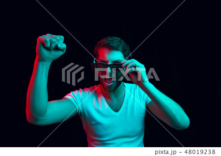 Enjoying his favorite music. 48019238