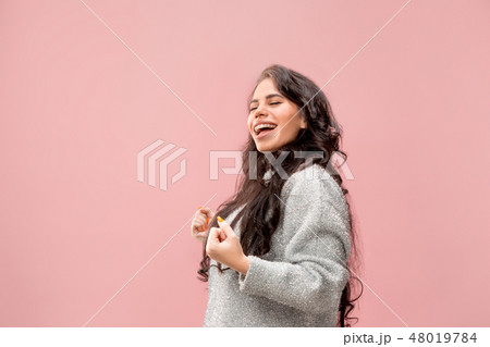 Winning success woman happy ecstatic celebrating being a winner. Dynamic energetic image of female Winning success woman happy ecstatic celebrating being a winner. Dynamic energetic image of female 48019784