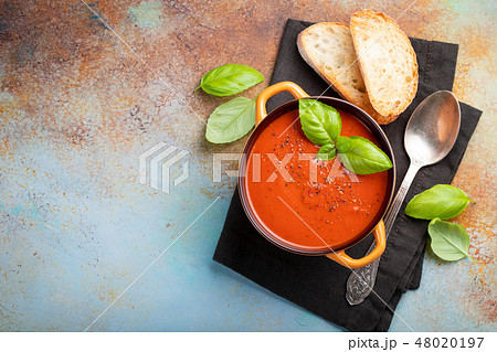 Homemade tomato soup with Basil. Homemade tomato soup with Basil. 48020197