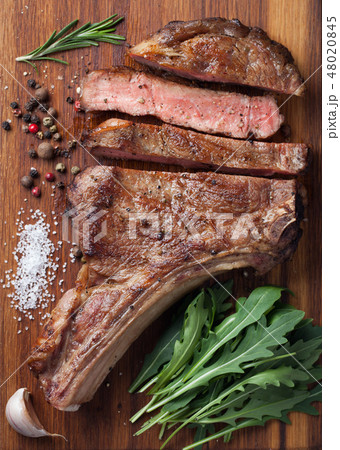 Grilled cowboy beef steak. 48020845