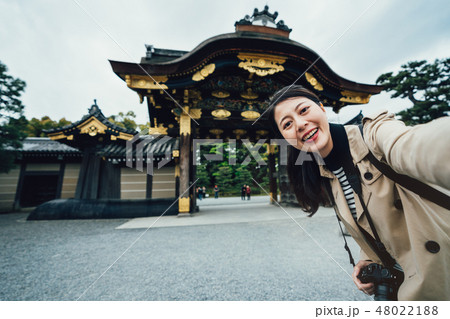 tourist make self photo portrait in front ground 48022188