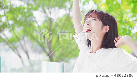 young woman feel carefree young woman feel carefree 48022386