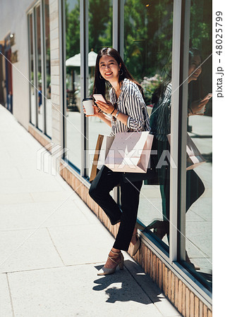 woman spending leisure time in shopping mall 48025799