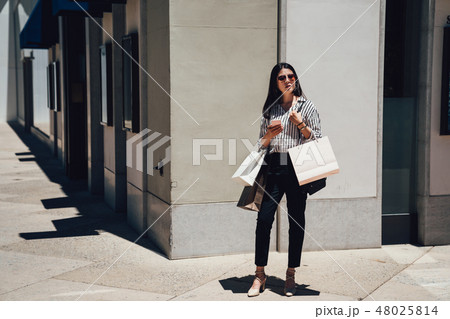 full length of young girl standing on corner 48025814
