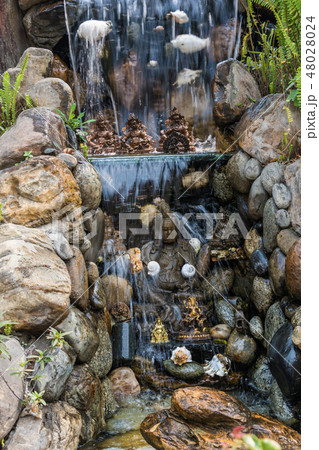 Fragment of man-made waterfall in the Park. Fragment of man-made waterfall in the Park. 48028024