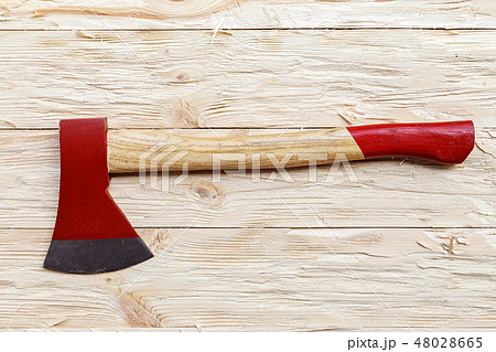 Red ax on a wooden background, top view 48028665