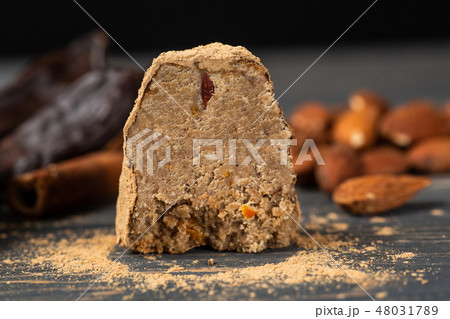 raw vegan sweet candy with carob, cinnamon almond 48031789