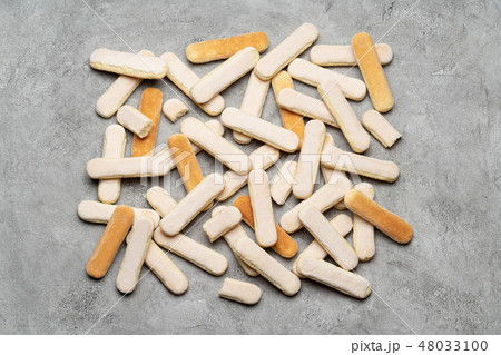 Italian Savoiardi ladyfingers Biscuits on concrete backgound 48033100