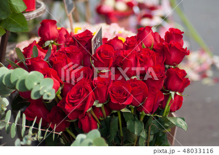 closeup of red roses bouqet at the florist 48033116