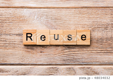 reuse word written on wood block.  48034032