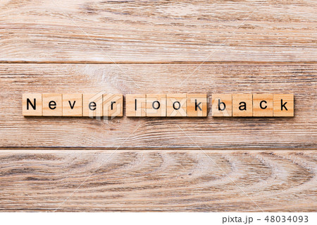 never look back word written on wood block never look back word written on wood block 48034093