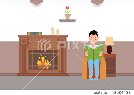 Man Reading Book Sitting by Fireplace at Home Man Reading Book Sitting by Fireplace at Home 48034458