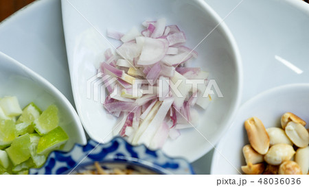 close up chopped red onion  for miang khum 48036036