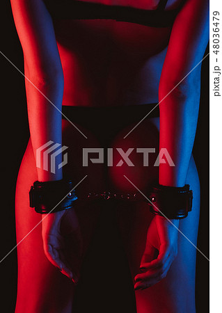 sexy girl in BDSM handcuffs with a slender beautiful body sexy girl in BDSM handcuffs with a slender beautiful body 48036479