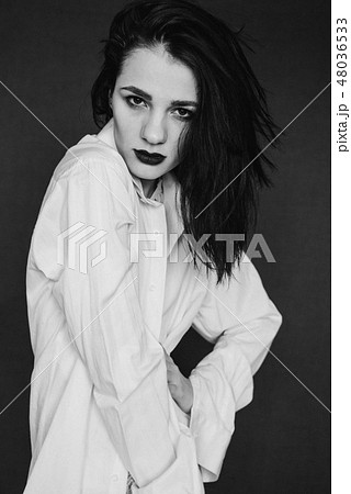 fashion portrait of attractive brunette girl posing in white shirt 48036533