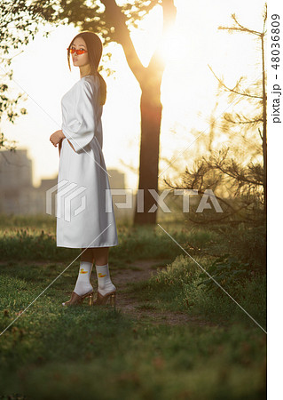Asian woman in traditional japanese kimono outdoors 48036809