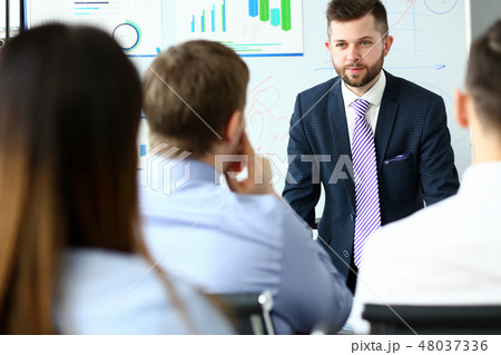 Young handsome teacher man in suit with Young handsome teacher man in suit with 48037336