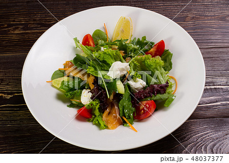 Salad with salmon and vegetables. 48037377