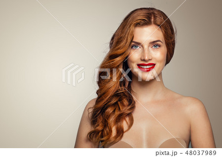 Happy redhead woman portrait. 48037989