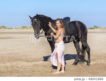 horse woman on the beach 48041066