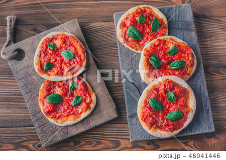 Mini Margherita pizzas with red cheese 48041446