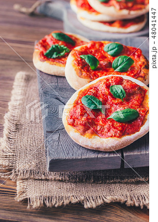 Mini Margherita pizzas with red cheese 48041447