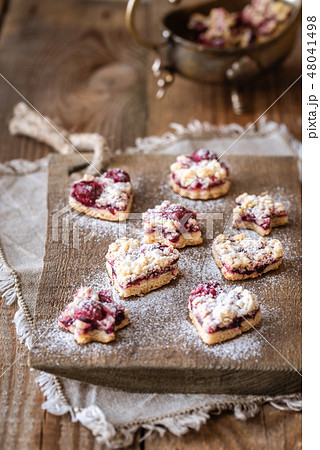 Shortbread biscuits with cherry filling Shortbread biscuits with cherry filling 48041498