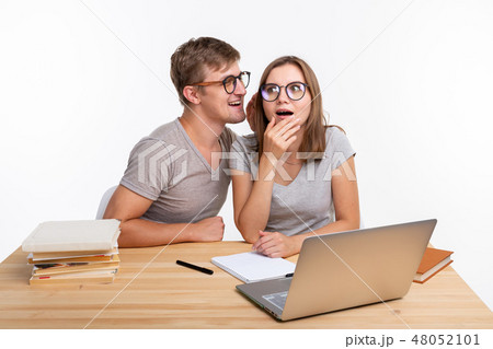 Education and people concept - couple of students look like they are surprised of something in their Education and people concept - couple of students look like they are surprised of something in their 48052101