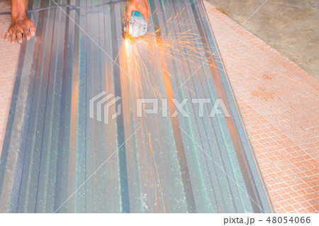 electric wheel on cutting metal sheet roof electric wheel on cutting metal sheet roof 48054066