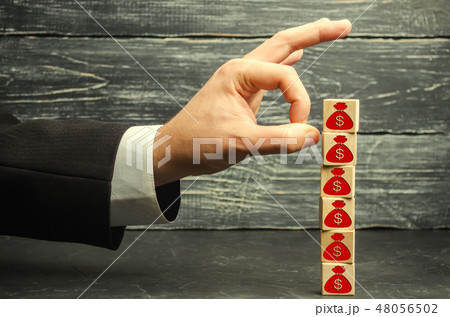 businessman removes a cube businessman removes a cube 48056502