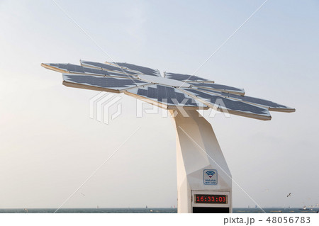 Photovoltaic panel on top of shower standing on the beach 48056783