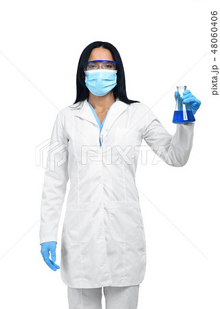 Woman with black hair in white lab coat looking at camera. 48060406
