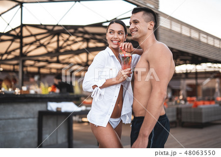 Waist up of young couple enjoying their summer rest and smiling 48063550