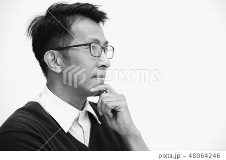 asian male with glasses thinking looking far sight 48064246
