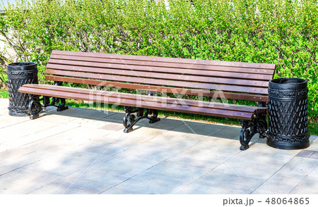 Wooden bench at the city street Wooden bench at the city street 48064865