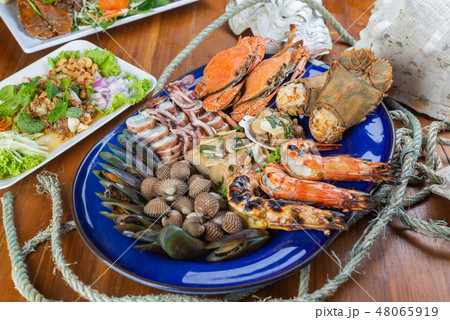 Food series: Variety of grilled seafood, top view Food series: Variety of grilled seafood, top view 48065919