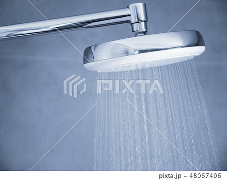 Flowing water from shower head at bathroom  48067406