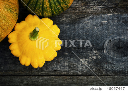 Pumpkin and peter pan squash on wood Pumpkin and peter pan squash on wood 48067447