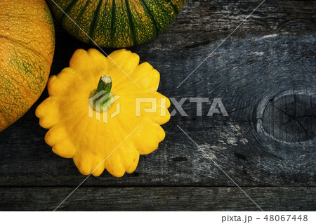 Pumpkin and peter pan squash on wood 48067448
