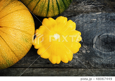 Pumpkin and peter pan squash on wood Pumpkin and peter pan squash on wood 48067449