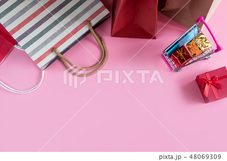 Shopping cart with credit card and shopping bag Shopping cart with credit card and shopping bag 48069309