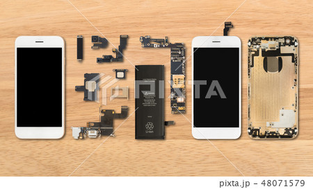 Smartphone components on wooden background Smartphone components on wooden background 48071579
