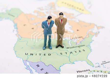 businessman standing on map American businessman standing on map American 48074599