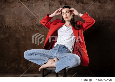Beautiful thoughtful woman posing for a photo 48075256