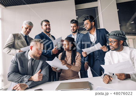 Female coach mentor talking with top managers in corporate training in office 48076022