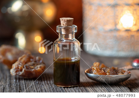 A bottle of myrrh essential oil with myrrh resin 48077993