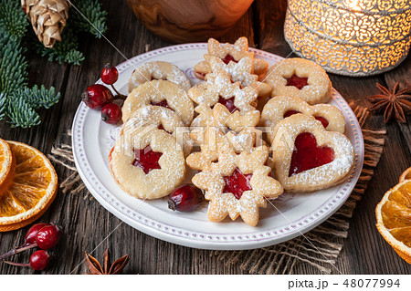 Linzer Christmas cookies arranged on a plate Linzer Christmas cookies arranged on a plate 48077994